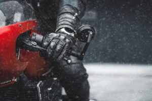 Close up of winter motorcycle glove while a riding in snow.