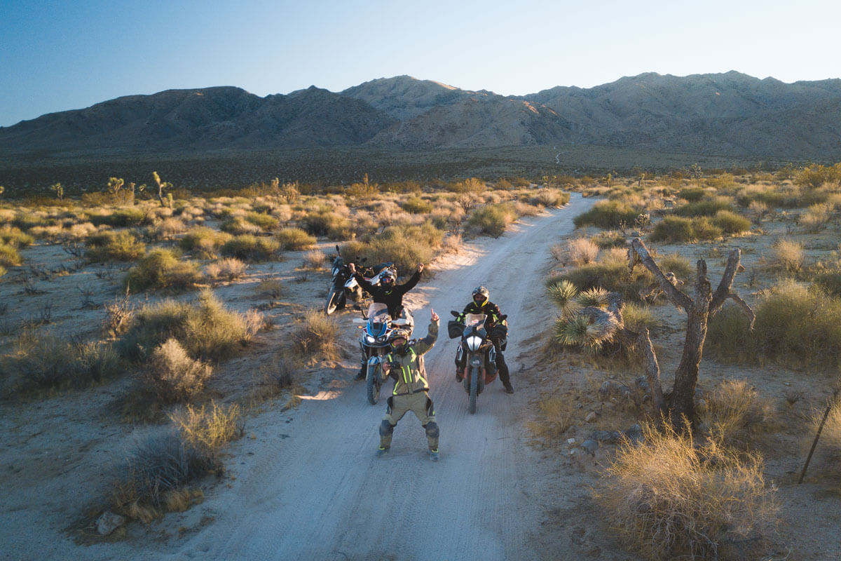The gang and I cheering the camera on while riding motorcycles in the desert.